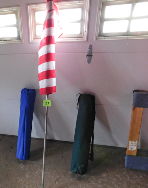 lot 23 image: two portable folding chairs and  an American Flag