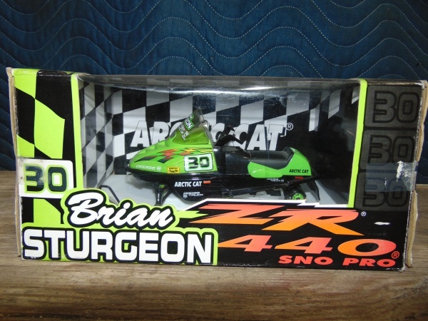 lot 45 image: Signed Die Cast Collector Arctic Cat Snowmobile Toy