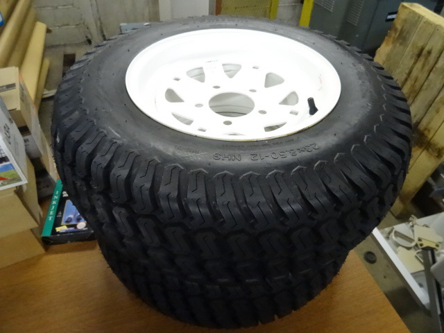 lot 244 image: New Rim and Tire 5 Hole Rim