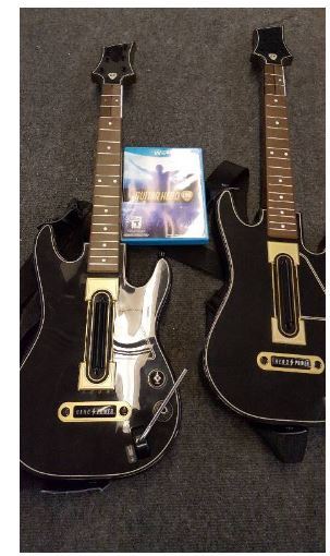 lot 141 image: Wii U Guitar Hero Live Bundle with 2 Guitar Hero Live Wireless Guitar Controllers