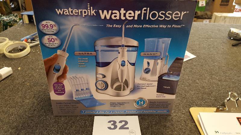 lot 32 image: WATerpik Water Flosser
