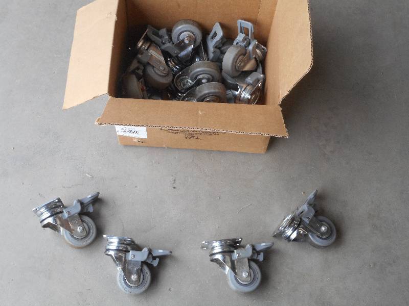 lot 22 image: Box Of Plastic Brake Caster Wheels, Like New