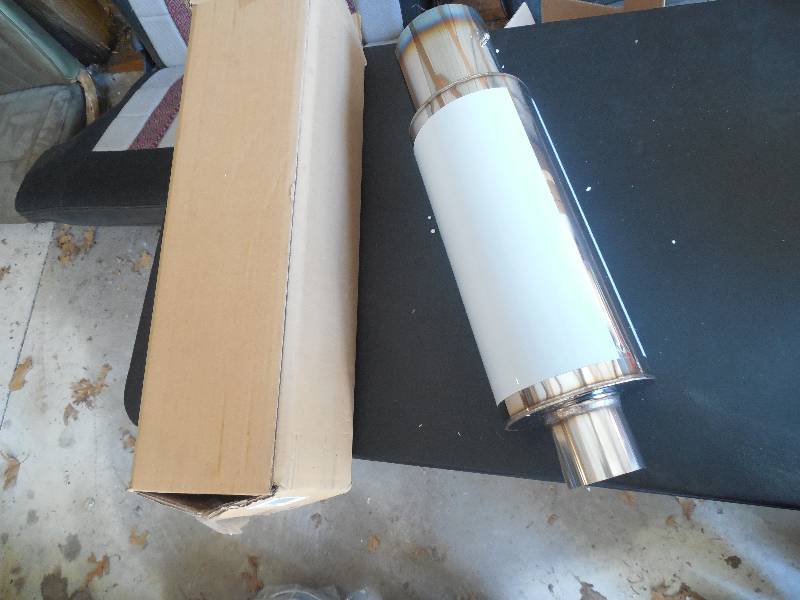 lot 234 image: NEW -TURBO MUFFLER FOR A RICE BURNER
