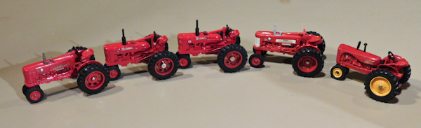 lot 81 image: Farmall die cast tractors