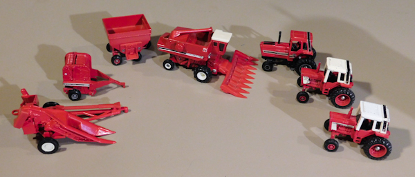 lot 89 image: Vintage ERTL International Tractors, cultivators, discs, balers