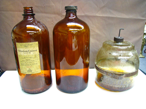 lot 103 image: Vintage large amber glass chemical bottles