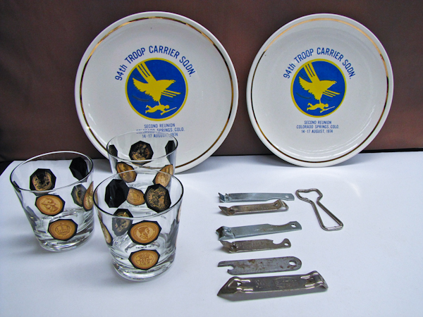lot 109 image: Vintage beer branded bottle openers, mid century cocktail glasses & military reunion plates