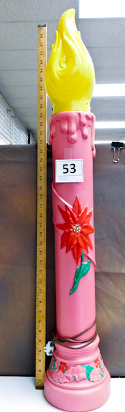lot 53 image: plastic yard christmas candle filled with sand for stability