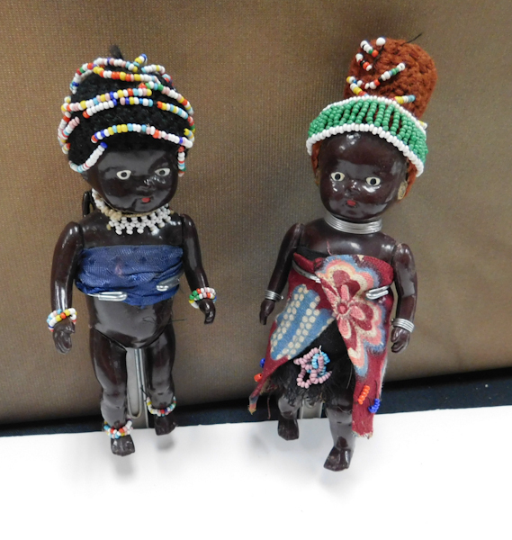 lot 123 image: vintage African dolls with stands one has a baby