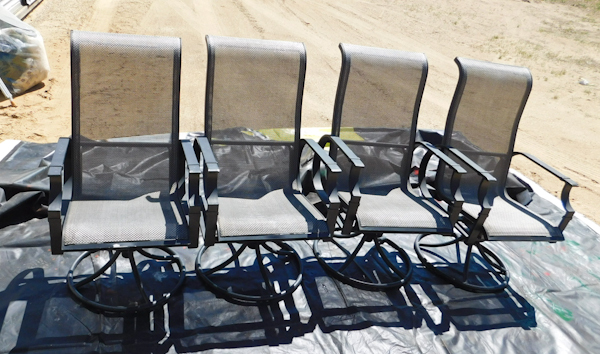 lot 202 image: 4 deck patio chairs they rock and swivel the fabric is intact some wear