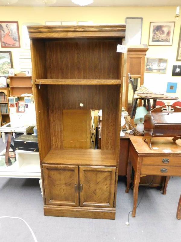 lot 187 image: Veneer bookshelf with two cabinet doors at the bottom of the cabinet