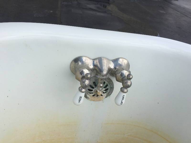 antique cast iron clawfoot tub from a 1950s farmhouse