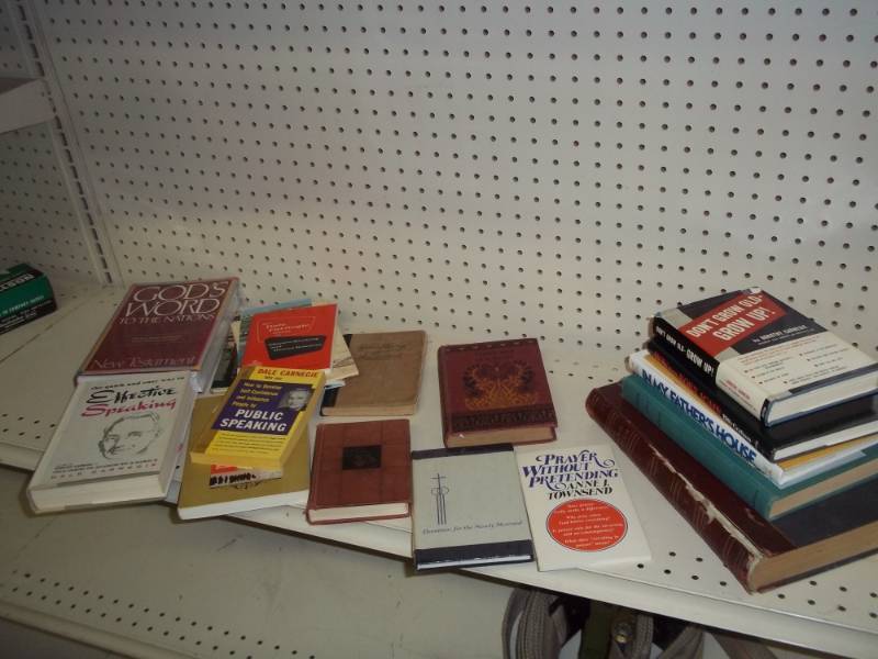 lot 222 image: New Bible still wrapped with other books