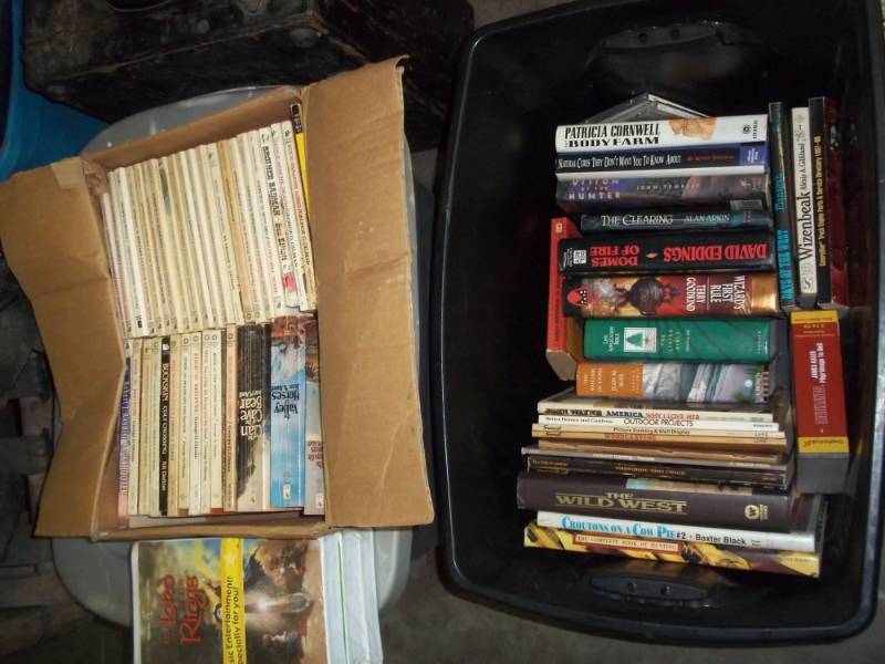 lot 300 image: Tub of books including woodworking how to books and New Lord of the rings VHS tape set, includes tub