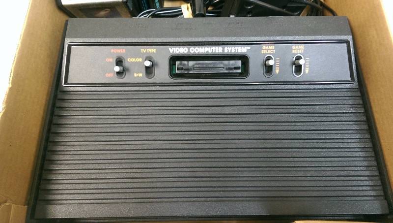 lot 15 image: Atari CX 2600A Game Console, PowerAV Cords, 7 Controllers and 18 Games Bundle