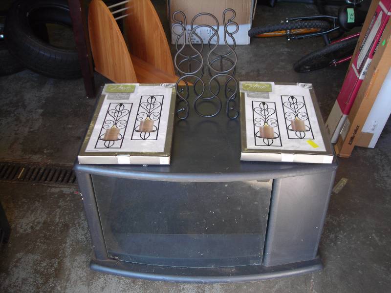 lot 4 image: Black Glass Door TV Stand, 2-Pair Sconces, Bottle Rack
