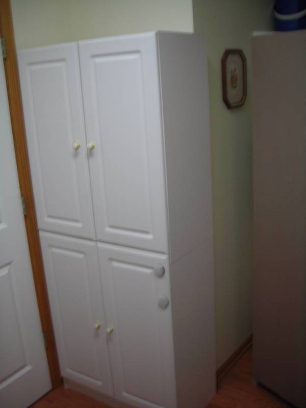 lot 53 image: 4-Door Cabinet 30x71x16