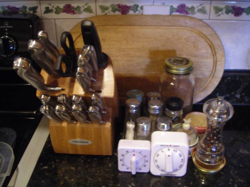 lot 98 image: Farberware Knife Block, Cutting Board, Salt & Peppers, Timers