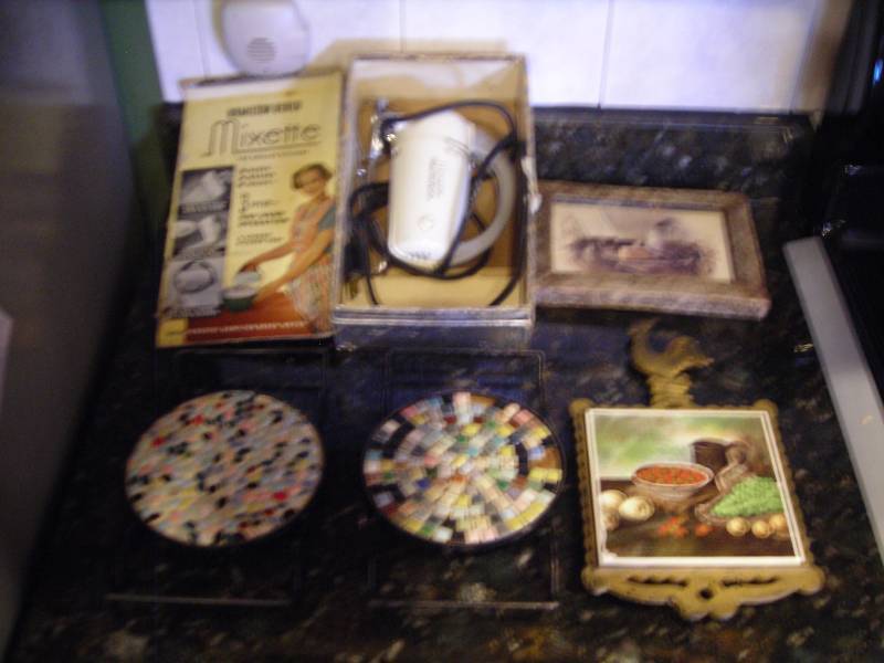 lot 116 image: Vintage Hamilton Beach Hand Mixer & Old Trivets