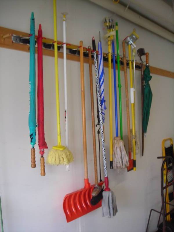 lot 156 image: All Implements On Wall-Shovels, Rake, Broom, Umbrellas