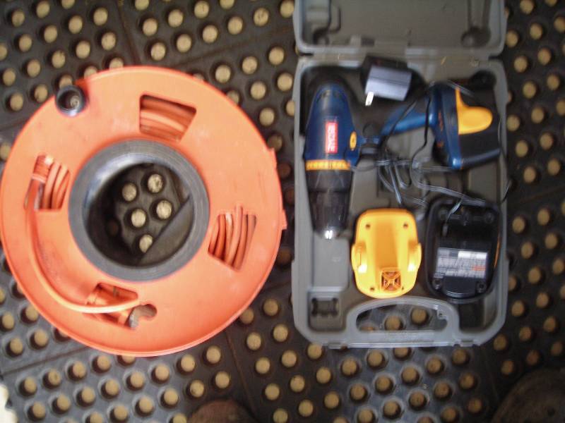 lot 174 image: Ryobi 12 Volt Drill & Extension Cord On Hand Reel