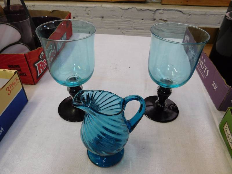 Two aquamarine colored stemware and pitcher