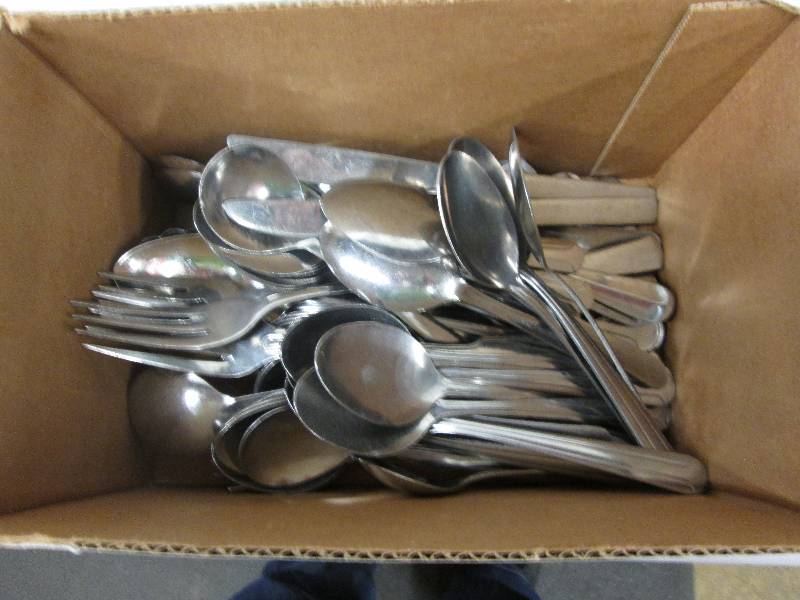 Lot of flatware, mostly soup spoons...