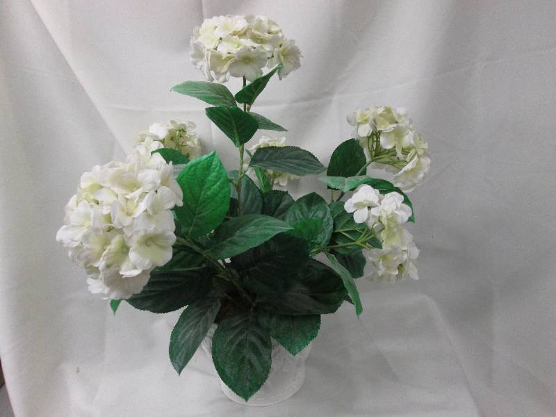 Artificial hydrangeas in white cera...