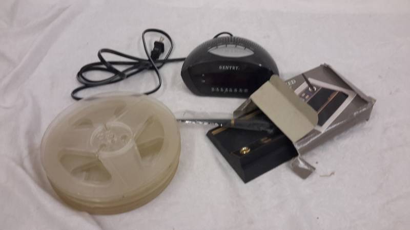 Reels, clock radio, and desk set