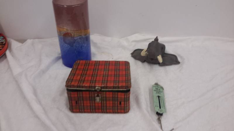 Scale metal lunchbox vase and ceramic elephant