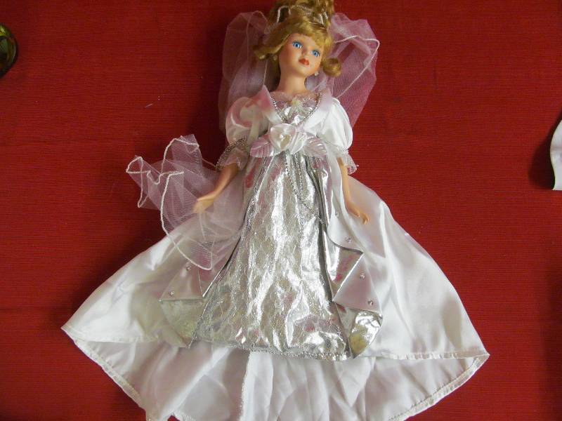 lot 114 image: Porcelain doll