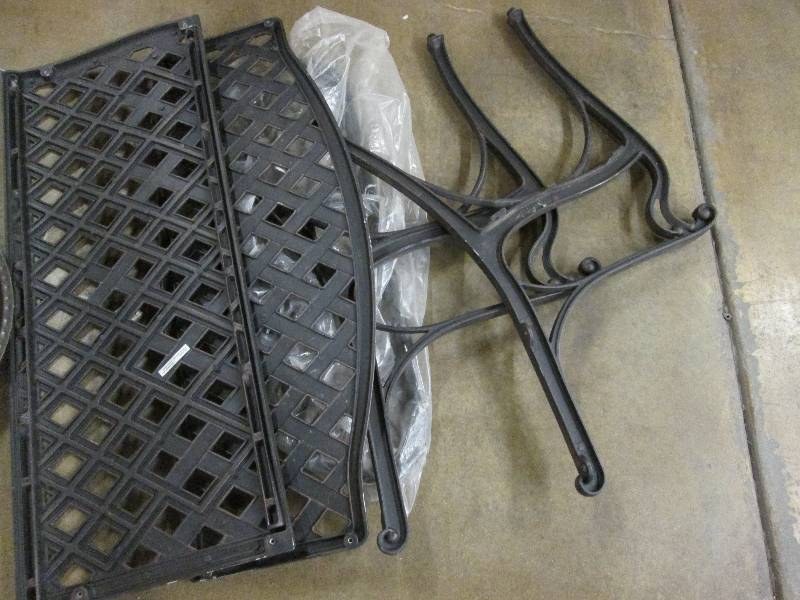 lot 60 image: Wrought iron garden bench...