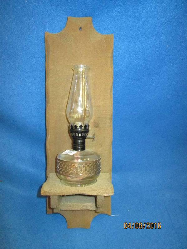 Wall hanging oil lamp in wood hange...