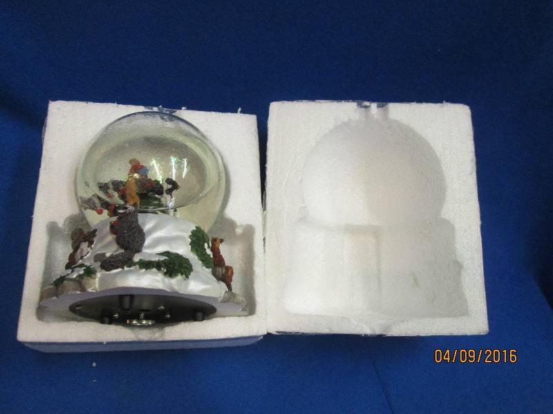 Snow globe with horse rider...
