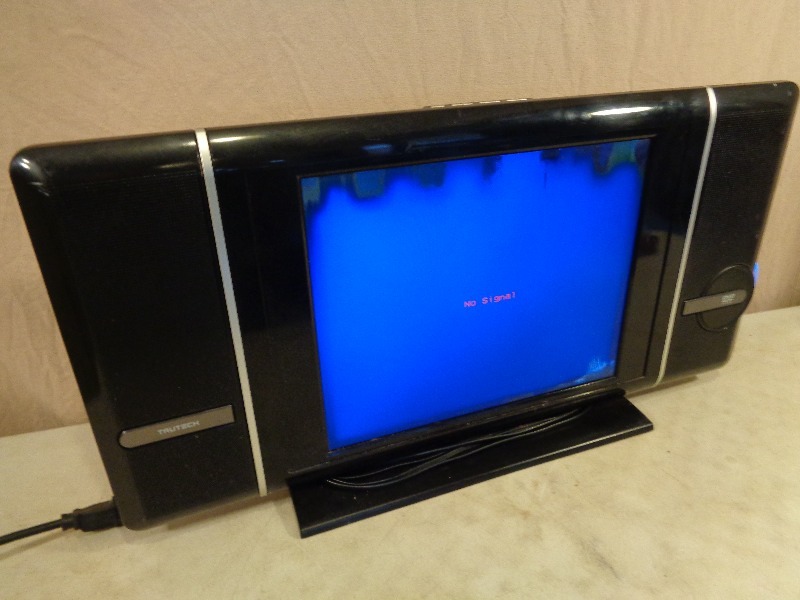 lot 8 image: Flat Screen TV with Built in DVD Player