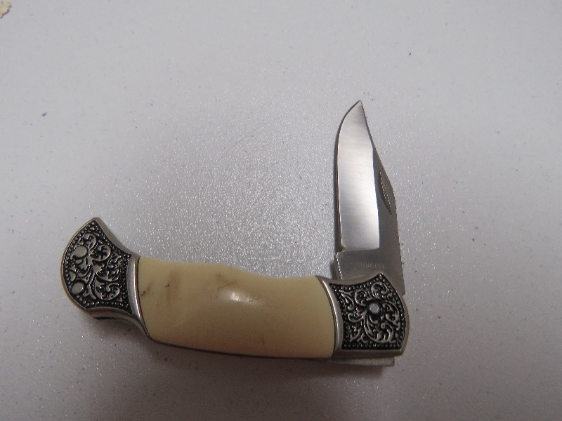 white handle with ornate