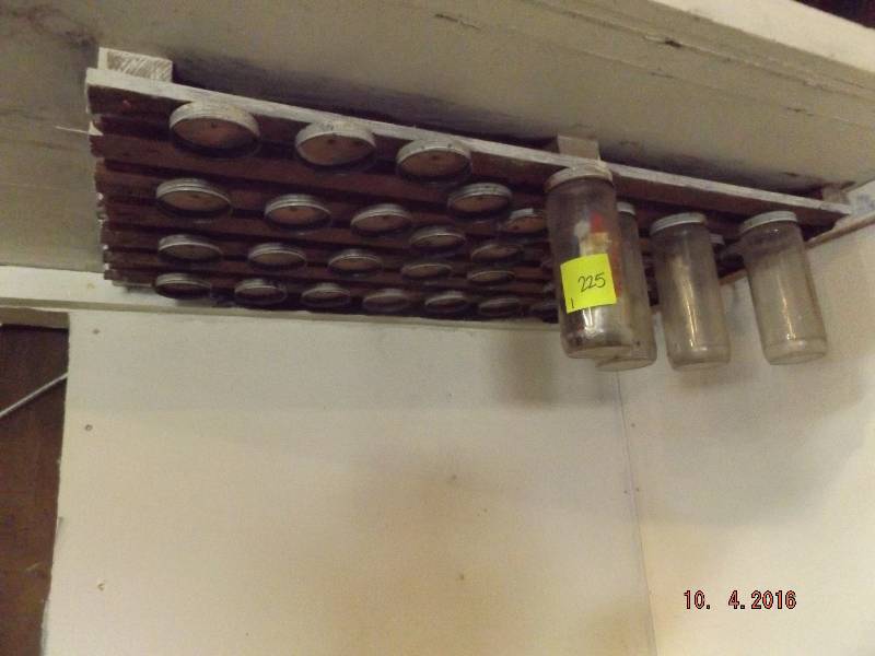 vintage home made hanging hardware rack.
