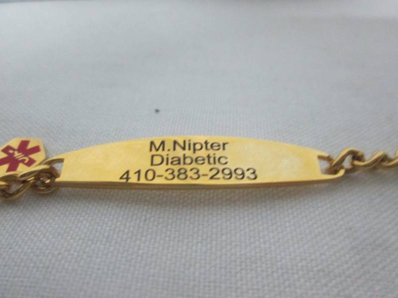 lot 56 image: Ladies Goldtone Steel Medical ID Bracelet
