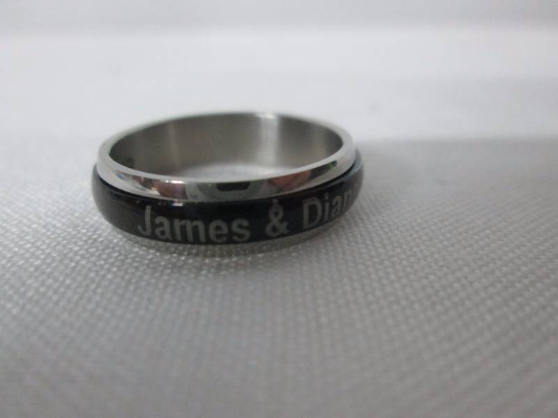 lot 69 image: Stainless Steel Ladies Personalized Couples Spinner Ring