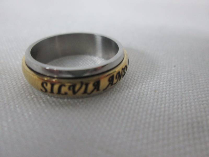 lot 70 image: Ladies Stainless Steel Personalized Couples Spinner Band