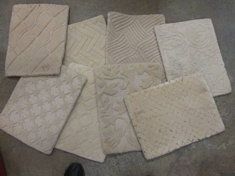 Lot of 8 assorted tan carpet square...