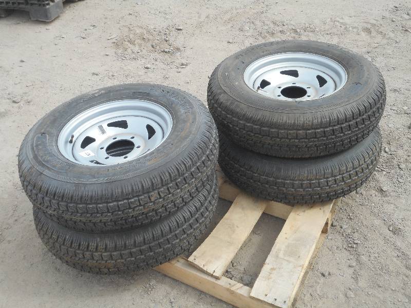 lot 17 image: (4) ST22575D15 Trailer Tires On 6-Lug Wheels, Unused, Tires Have Weather Checking