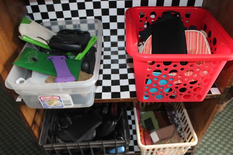 Contents of Shelves Including Phone Cases Wallets