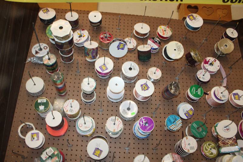 Contents of Peg Board Display Case Including Ribbon Rolls