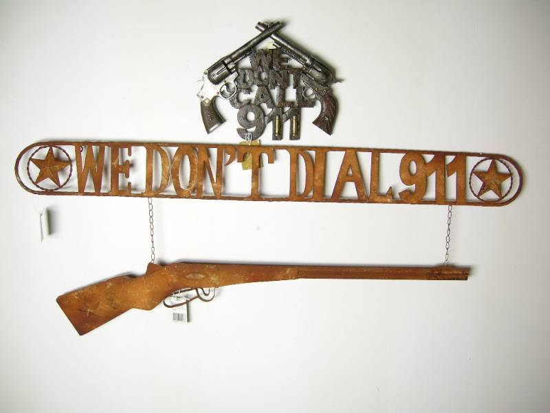 lot 40 image: We Dont Dial 911 Wall Hangers