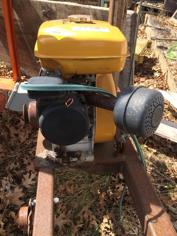 Motor  Engine and stand - used in past to drive a lumber saw blade