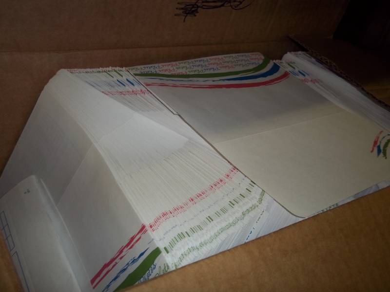 lot 32 image: New 1000 photo envelopes
