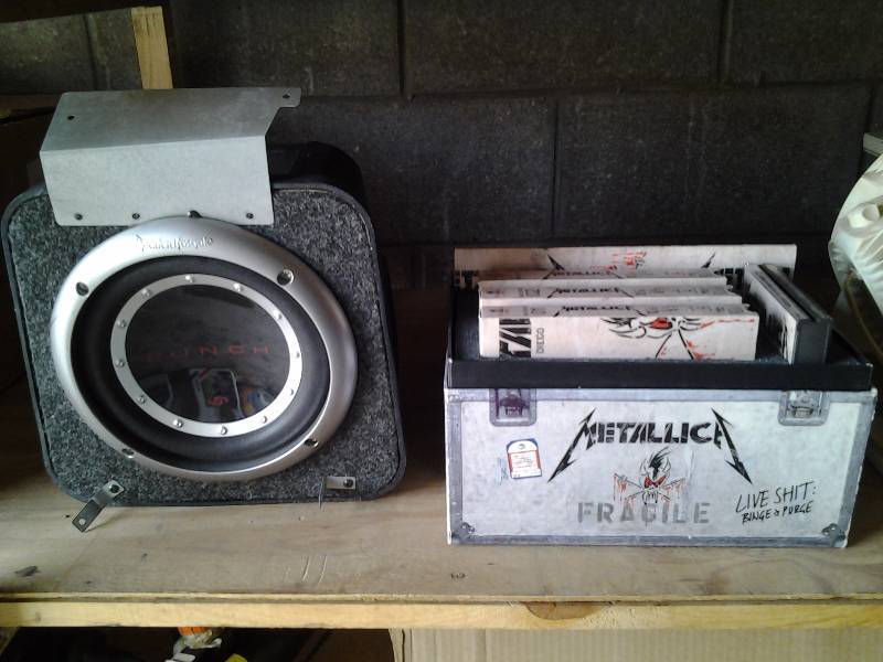lot 47 image: Rockford-Fosgate Punch Sub-Woofer & Metalica Collector Set Of VHS & CDs