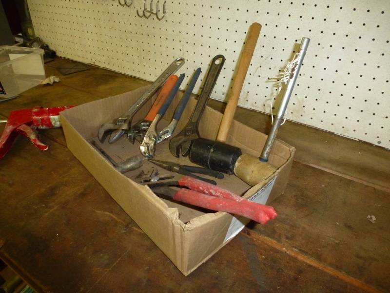 lot 131 image: Cresent wrenches, pliers, caulk gun, rubber mailots