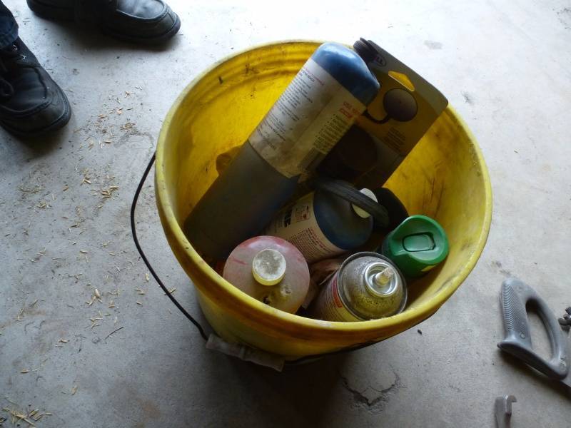 lot 187 image: Yellow Pail with cleaners and propane tank